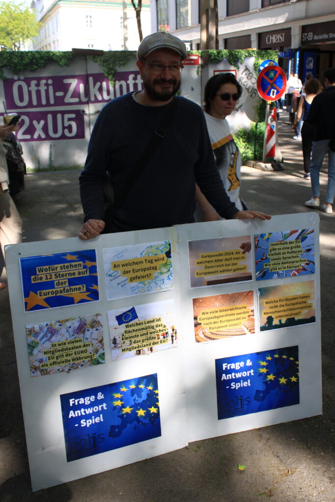 Ein Mann mit Plakat